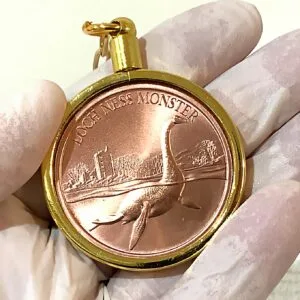 The LOCH NESS MONSTER 1 oz. 0.999 Copper (Gold Bezel) Keychain